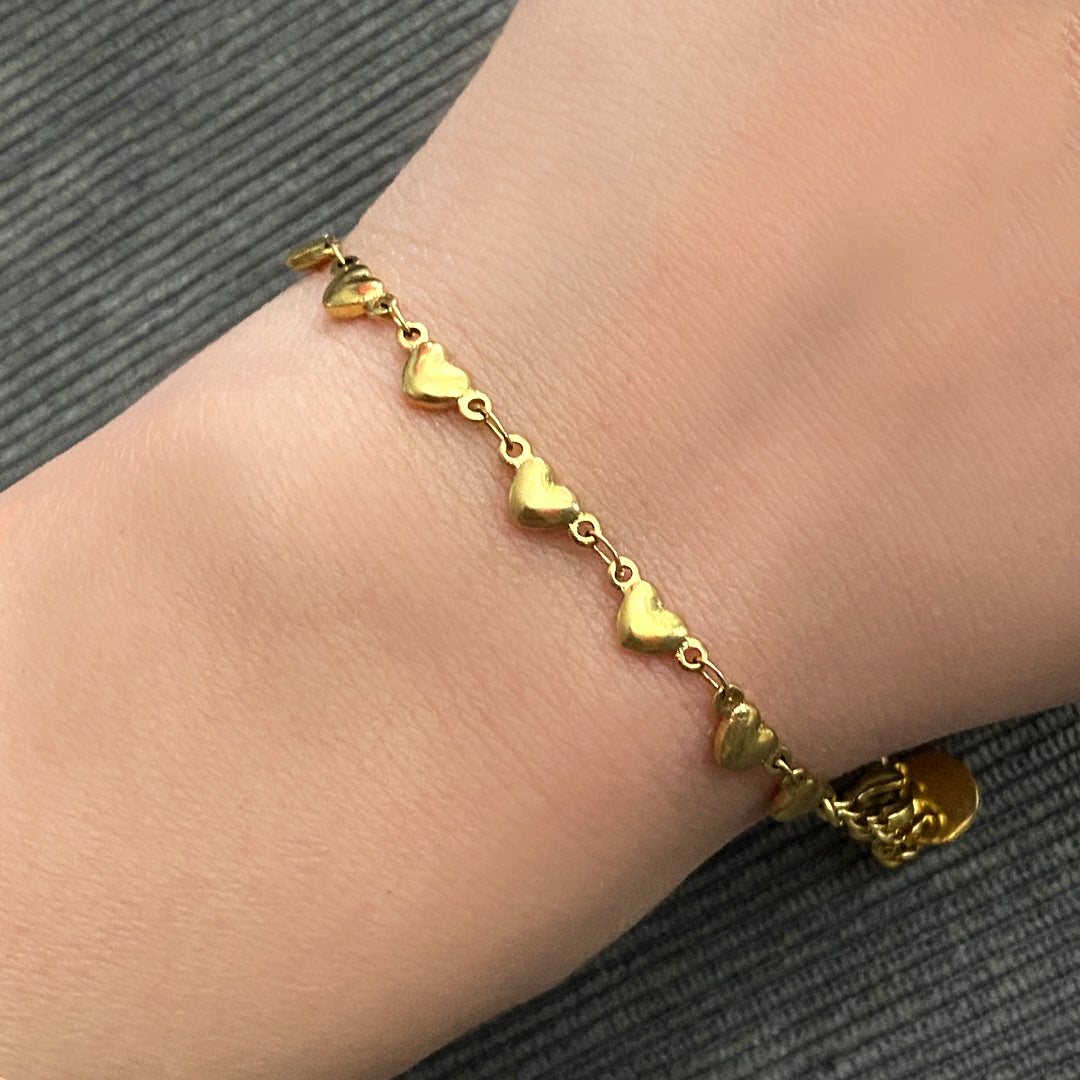 Bracciale con cuoricini color oro